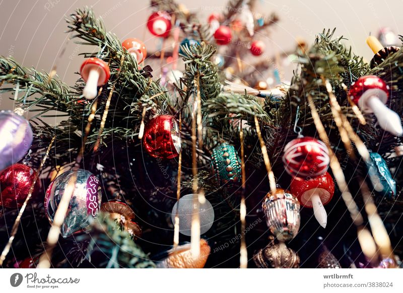 A detail of a classic German Christmas tree with real candles and ...