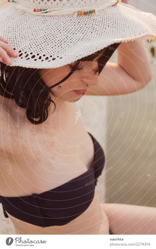 Free Photo  Woman in bikini in hat by the pool