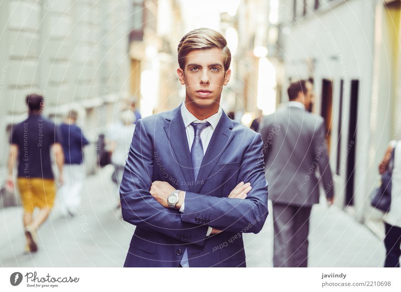 Young Handsome Business Man In Blue Suit With White Shirt And Red Tie  Standing On A Hill On A Background Of City, Greenery And Sky With Clouds  Stock Photo, Picture and Royalty