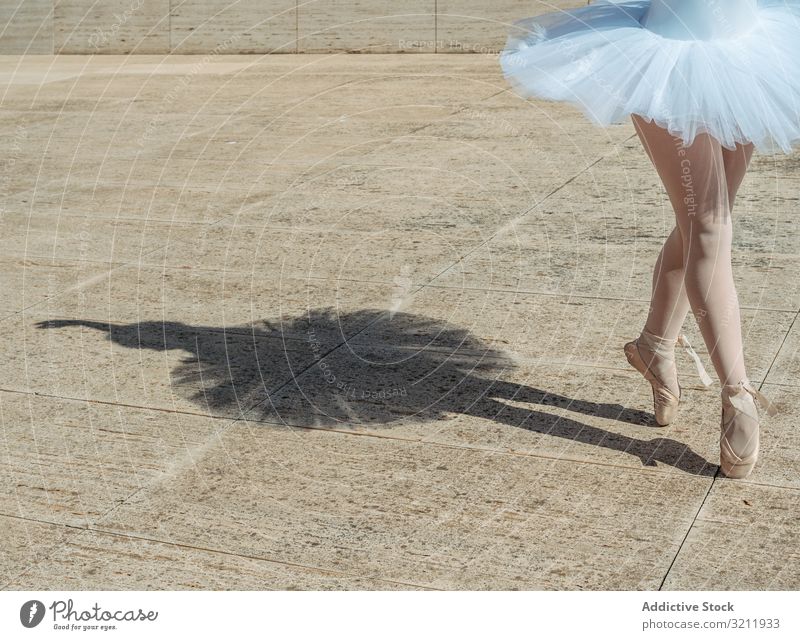 Slender ballerina in ballet pose on stool - a Royalty Free Stock Photo from  Photocase