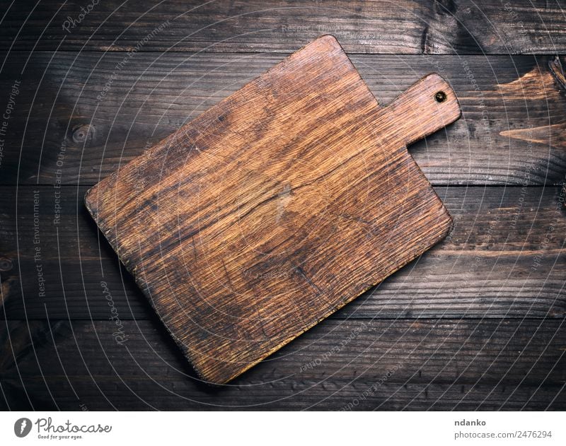 brown wooden kitchen cutting board - a Royalty Free Stock Photo