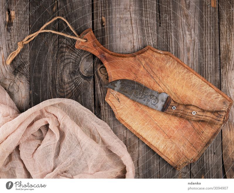 brown wooden kitchen cutting board - a Royalty Free Stock Photo