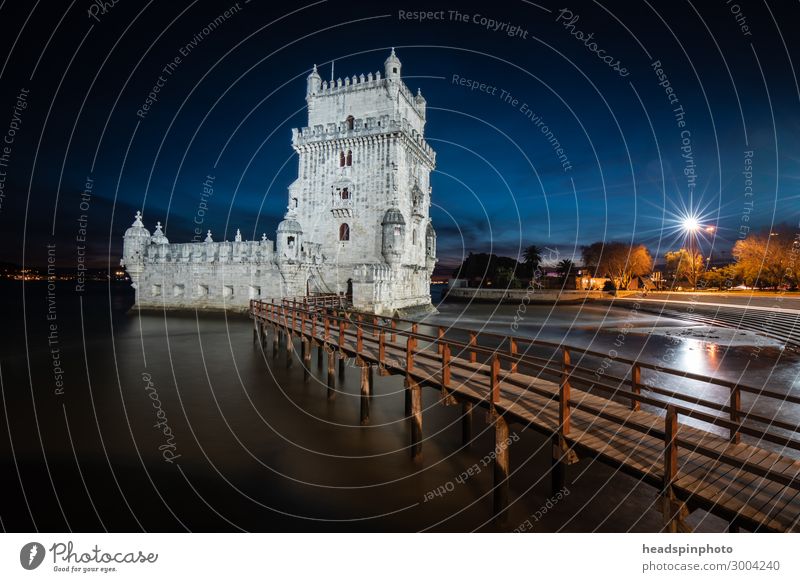 Beautiful vintage city of Lisbon with river, bridge and colorful sunset  evening sky with stars. Amazing starry sky. Space wallpaper Stock Photo