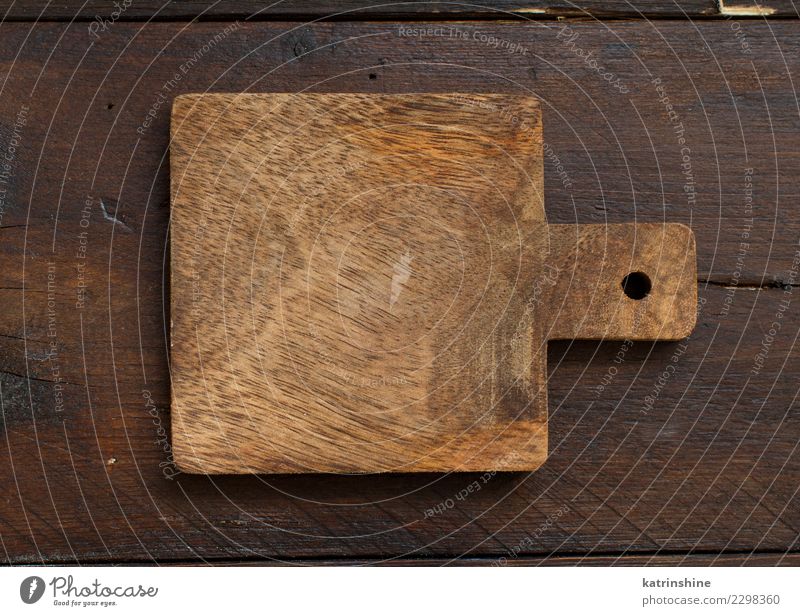 Cutting Board On Dark Wood Background Top View Stock Photo